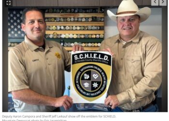 Deputy Aaron Campora and Sheriff Jeff Leikauf show off the emblem for SCHIELD